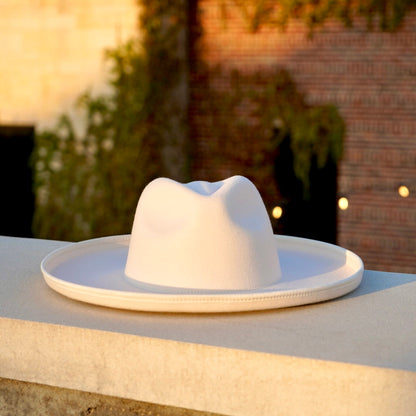 Wholesale Fedoras pencil rolled brim hat in off white color.